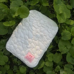 Detailed view of the Korean quilted floral tablet sleeve, white bubble cotton laptop bag.