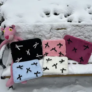 Close-up detail of cute Korean ins plush laptop sleeve bag with lovely bowknot decorations.