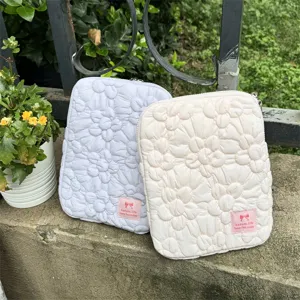 Quilted floral tablet sleeve and laptop storage bag with cute bow label for daily use.