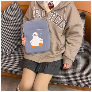 Cute cartoon duck tablet sleeve, soft protective bag for iPad and laptop, portable accessory.