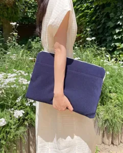 Navy blue corduroy laptop sleeve and tablet protective case with minimalist design.