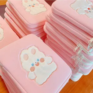 Cute pink fluffy laptop sleeve with embroidered cartoon rabbit design, soft tablet storage bag