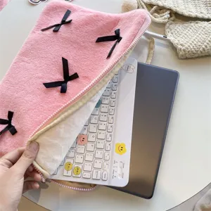 Cute pink plush laptop sleeve with black bows, soft interior inner bag for tablet PC.