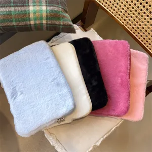 Plush laptop sleeve detail showcasing soft furry texture and vibrant multi-color design.
