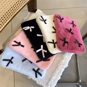 Cute bow plush laptop sleeve detail, soft fuzzy notebook case, cozy aesthetic design.