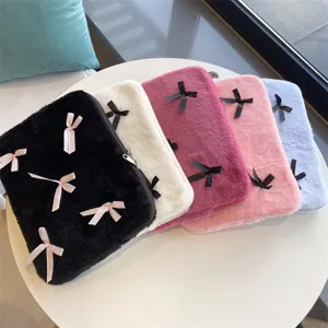 Detailed view of cute Korean style bow plush laptop sleeve, soft furry texture, multi-color.