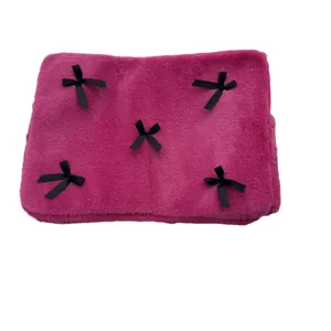Cute pink plush laptop sleeve with black bows, soft fuzzy computer pouch case for women.