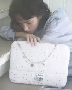 White star pattern laptop bag with silver chain strap and brand patch for daily use.