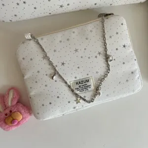 White star pattern laptop sleeve with metal chain decor, chic aesthetic digital storage bag.