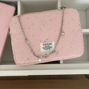 Pink star pattern laptop sleeve bag with silver metal chain strap and cute charms for daily use