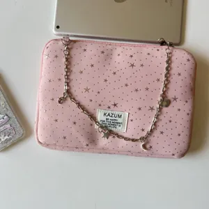 Detailed close-up view of KAZUM pink star padded laptop sleeve featuring a chic metal chain strap.