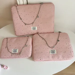 Pink star laptop sleeve detail, cute chain decoration, soft fabric tablet storage bag.