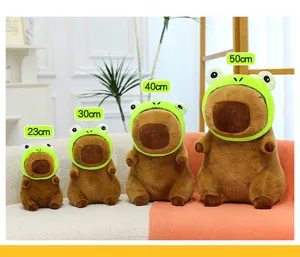 Cute capybara plush toy wearing green frog hat soft stuffed animal doll gift for kids
