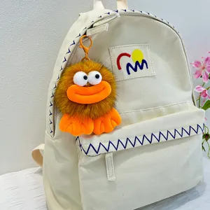 Mochila de lona con bonito colgante de peluche naranja, bolso escolar elegante y casual.