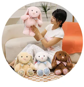 Cute floral lop-eared bunny plush toy, soft stuffed animal doll for girls and room decor.