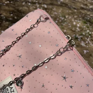 Pink star pattern laptop bag with metal chain strap, cute aesthetic sleeve for iPad.