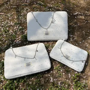 KAZUM white star pattern laptop bag and iPad storage sleeve set with decorative chain.