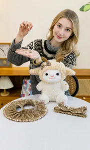 Plush sheep toy detail featuring cute stuffed animal with removable tweed dress and pearl necklace.