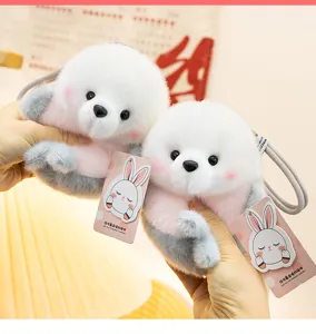 Cute marine plush pendant detail showcasing soft texture, pink blush and a cute hangtag.