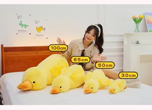 Cute yellow duck plush pillow toy, soft stuffed animal doll in multiple sizes for sleeping.