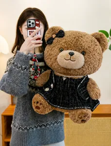Cute brown plush bear doll wearing a black tweed dress, soft stuffed animal gift for kids and girls.