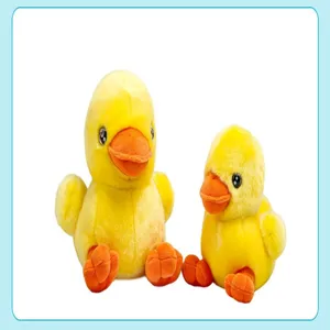 Cute plush yellow duck toy detail view, soft stuffed animal doll for desktop decor and gifts.