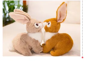 Close-up detail of cute realistic plush twin rabbit dolls showing affectionate kissing pose.