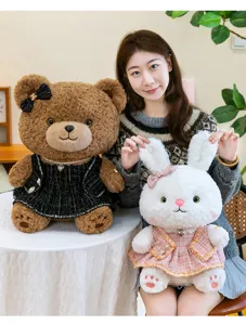 Cute plush toy set featuring a brown bear and white bunny in elegant tweed dresses for cozy hugging.