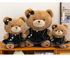 Cute plush teddy bear toy with black tweed dress and pearl necklace, soft companion doll gift.