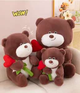 Simpatico peluche orsetto marrone con cuore rosso rosa, morbido cuscino di animale imbottito.