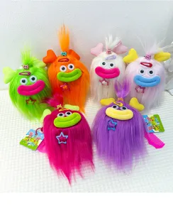 Cute plush monster keychain with big lips and colorful long hair, soft bag charm accessory.