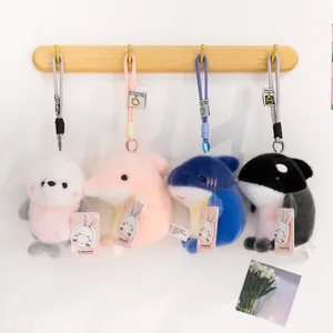 Cute marine animal plush keychain set, soft whale and shark toy pendant for bags and keys.