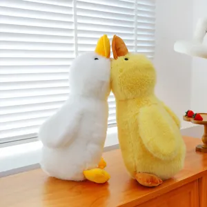 Cute plush duck stuffed animal toy pair, soft hugging pillow for kids and home decor.