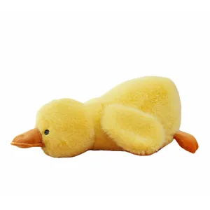 Cute yellow plush duck hugging pillow, soft stuffed animal doll for kids and sleeping.