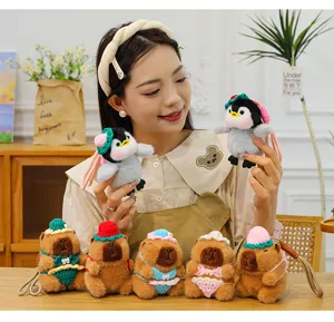 Cute plush penguin and capybara keychain set with handmade crochet bikini and hat for bags.