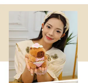 Charming knitted bikini capybara plush keychain detail close-up view accessory fashion.
