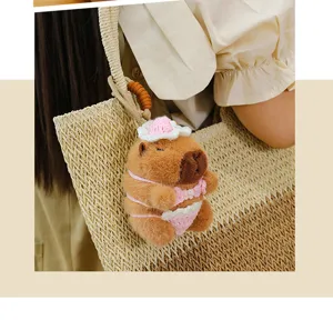 Cute capybara plush keychain with pink crochet bikini, bag pendant toy charm gift.