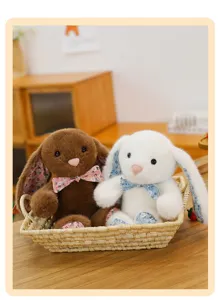 Cute long-eared plush bunny doll with floral bow, soft stuffed animal toy for home decor.