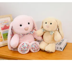 Cute plush long-eared bunny toy detail showing soft floral ear lining and bow tie setup.