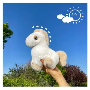 Close-up detail of the cute white plush horse toy featuring soft fabric and unique star eyes.