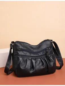 Black faux leather women shoulder crossbody bag with multi-zipper pockets and pleated detail.