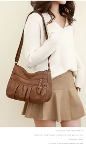 Detailed shot of women brown leather shoulder bag, multi-zipper pockets, daily use lifestyle.