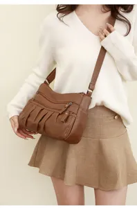 Women brown shoulder crossbody bag stylish casual PU leather multi-pocket everyday handbag.