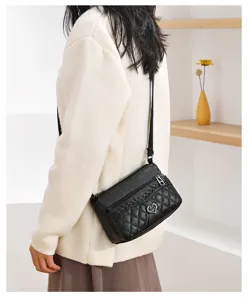 Classic black quilted crossbody bag for women, soft leather casual shoulder bag with heart charm.