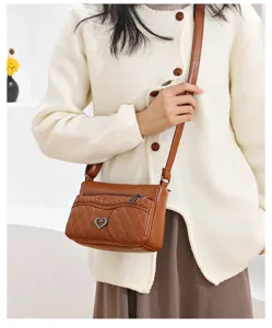 Retro brown quilted leather crossbody bag with heart charm, casual small shoulder bag for women