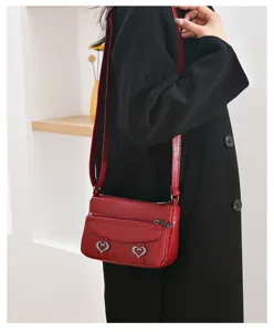 Red soft leather crossbody bag detail, women's small square shoulder bag with cute heart buckles