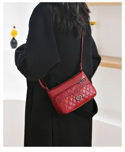 Retro women's red soft leather crossbody bag, stylish quilted shoulder phone purse for daily wear.