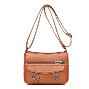 Vintage women PU leather crossbody shoulder bag with cute heart metal buckles and multi zippers.
