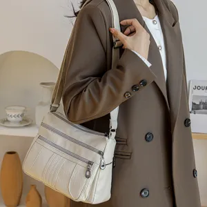 Multi-pocket soft leather shoulder bag for women, stylish casual crossbody daypack.