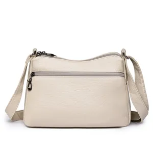 Crossbody soft leather bag with multi-pocket design, casual shoulder bag for daily commuting.